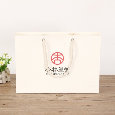 纸袋定做 企业广告礼品购物包装 手提绳子加强版白卡牛皮纸袋定做